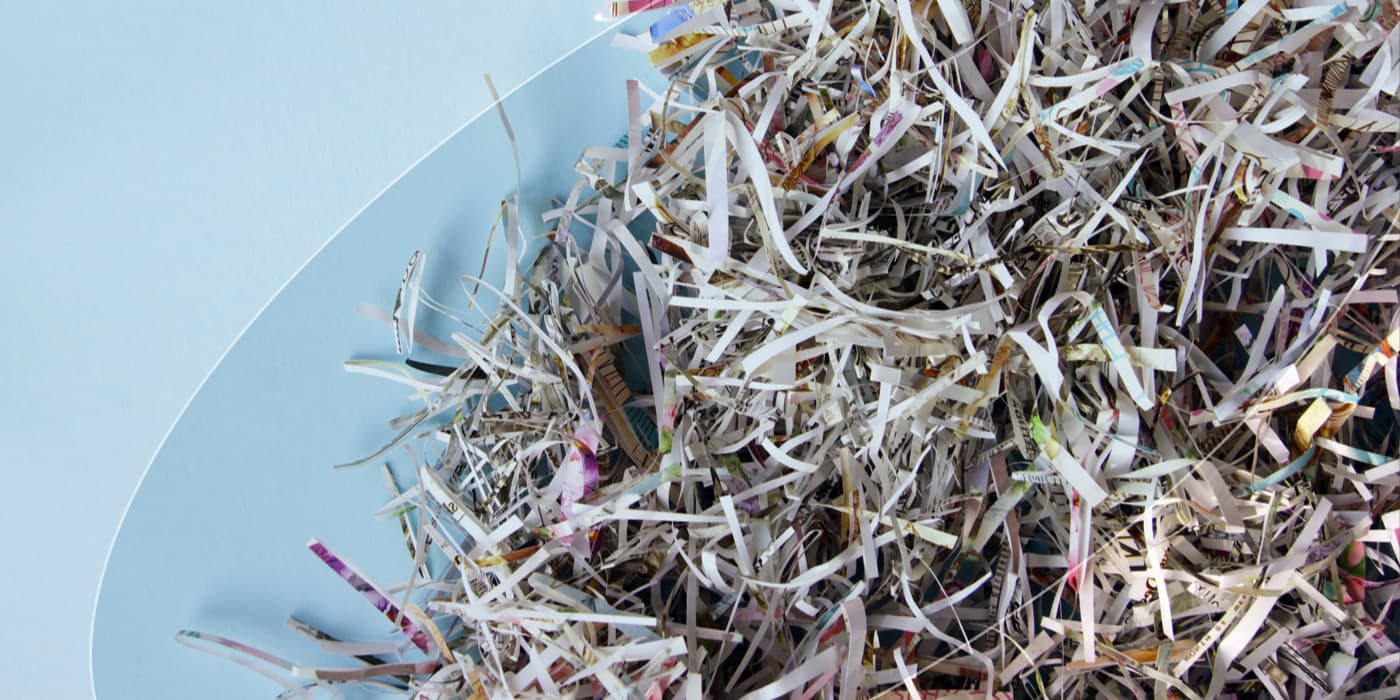 A large bin containing shredded paper.